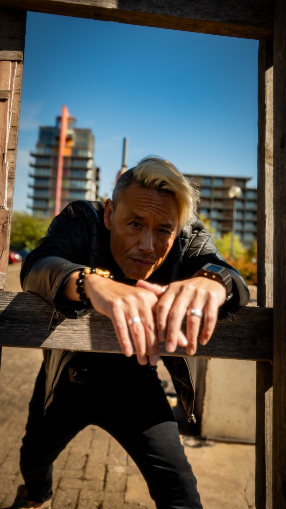 Simon Wan in the city of glass and concrete, shot by Amy Ireland.