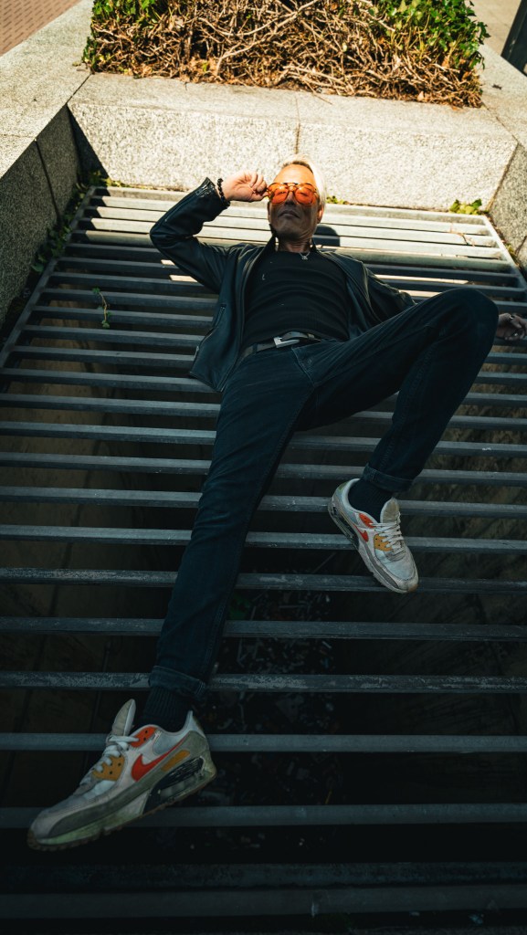 Simon Wan in the city of glass and concrete, shot by Amy Ireland.