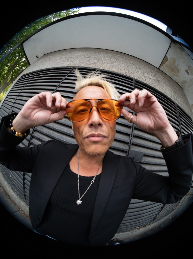 Simon Wan in the city of glass and concrete, shot by Amy Ireland.