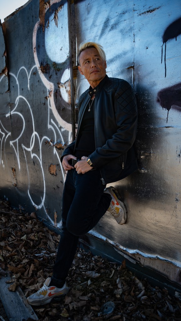 Simon Wan in the city of glass and concrete, shot by Amy Ireland.